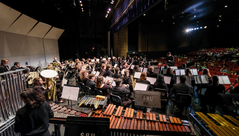 Concert band performing in Miller Theater