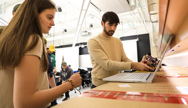 Students building robots