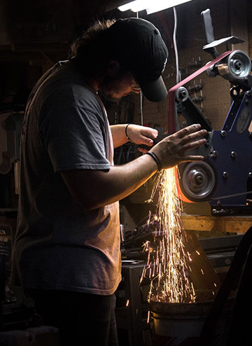 Finch polishing a blade