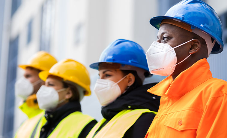 Workers with hard hats on