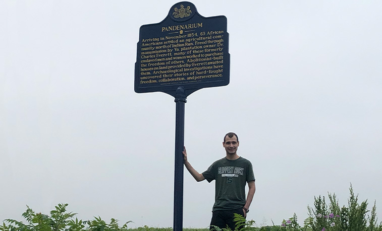 Student with a site marker