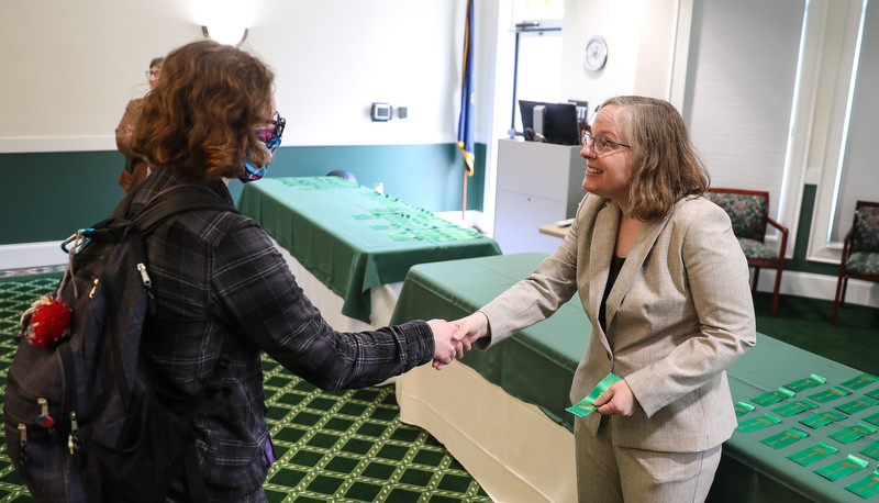 Student receiving a dean's list ribbon