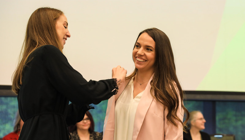 Badge being awarded