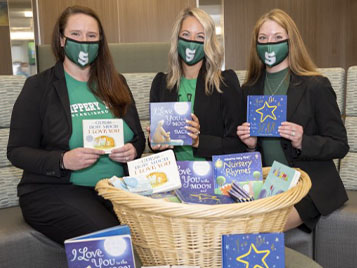 Students with the book they donated