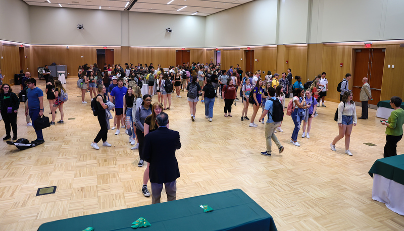 Students receiving ribbons for making the Dean's list