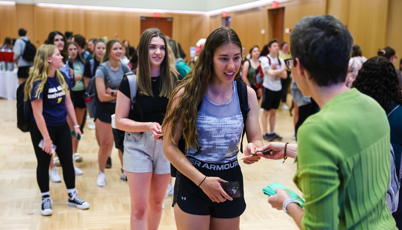 Students receiving ribbons for making the Dean's list