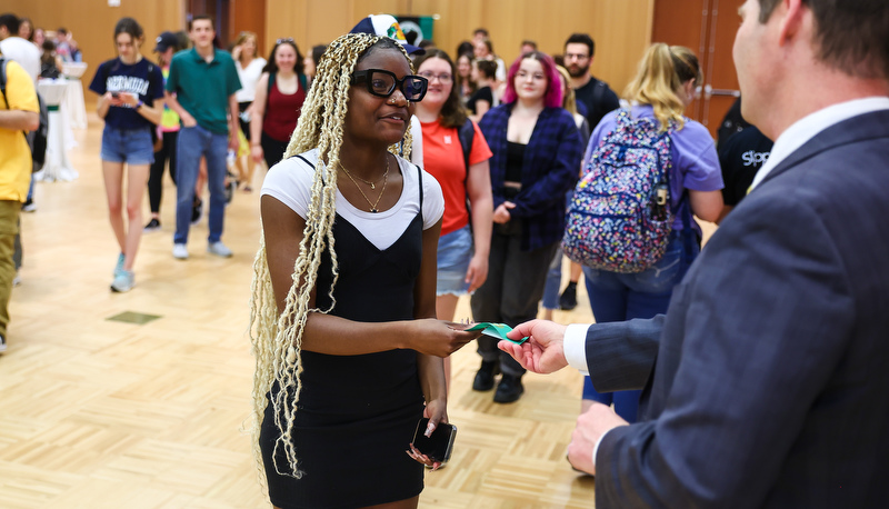 Students receiving ribbons for making the Dean's list