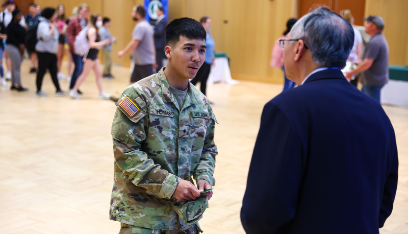 Students receiving ribbons for making the Dean's list