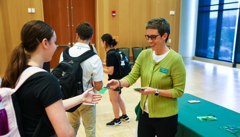 Students receiving ribbons for making the Dean's list