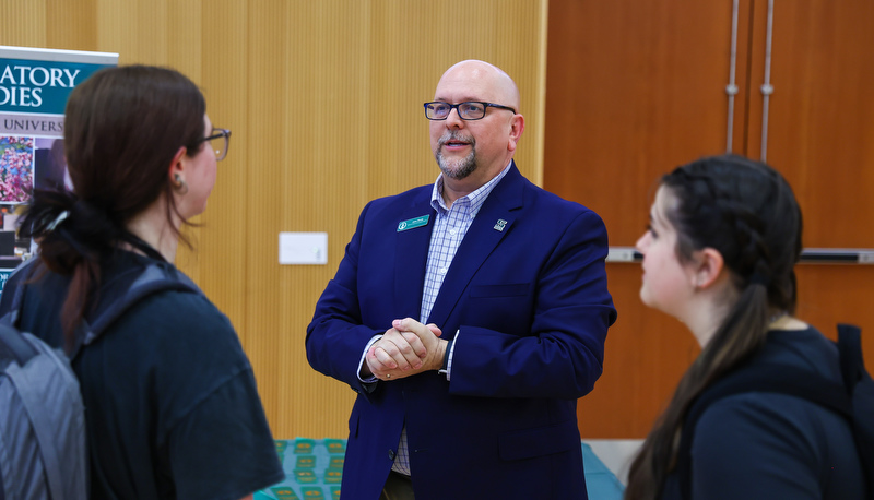 Students receiving ribbons for making the Dean's list