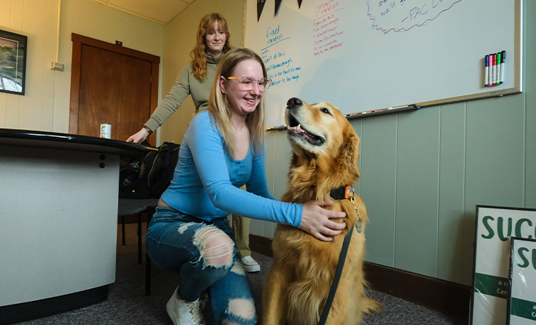 Student with a therapy dog