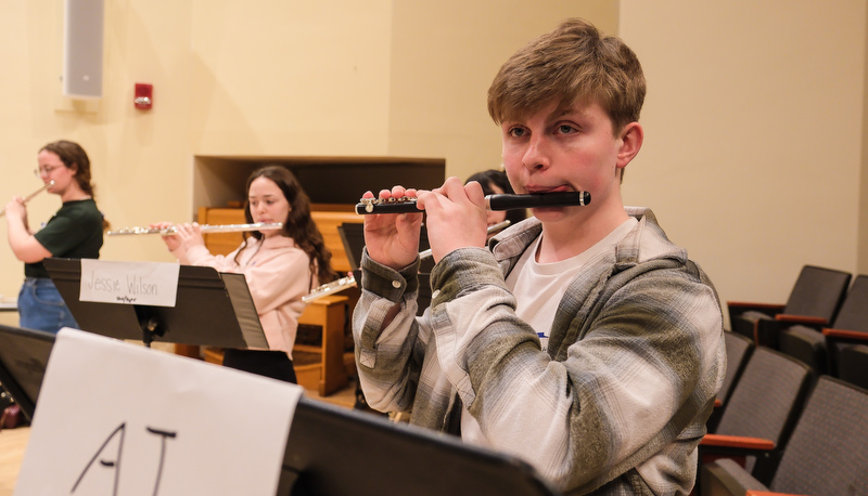 Honors flute ensemble preparing for their performance