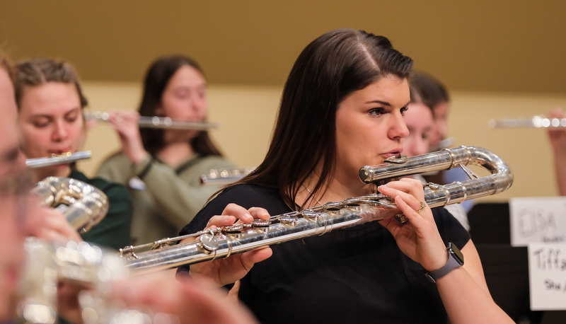 Honors flute ensemble preparing for their performance