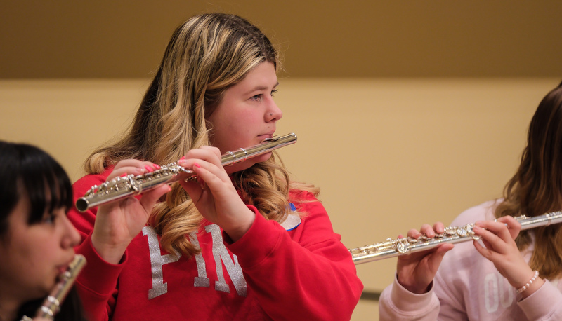 Honors flute ensemble preparing for their performance