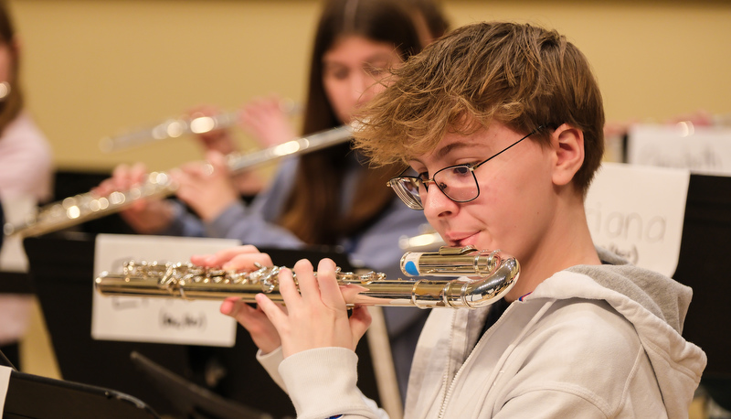 Honors flute ensemble preparing for their performance