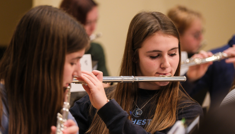 Honors flute ensemble preparing for their performance