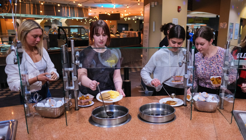 Students enjoy late night breakfast