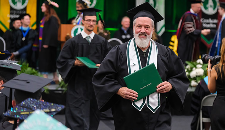 Graduate at commencement