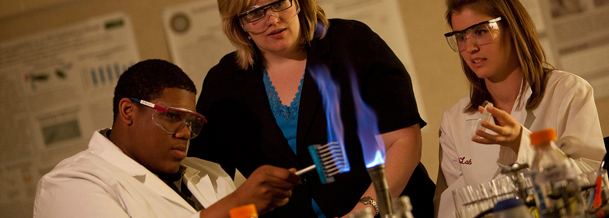 Biology students work with a Bunsen burner