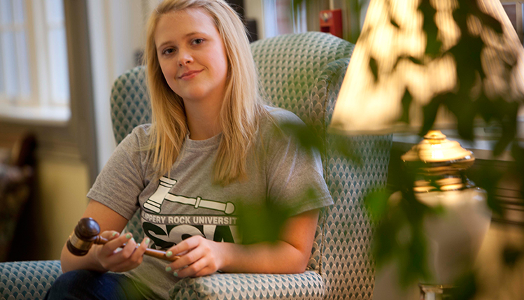 Student sitting in armchair