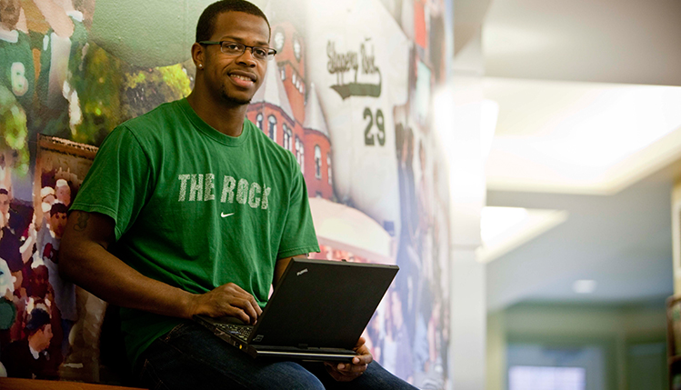 Student holding laptop