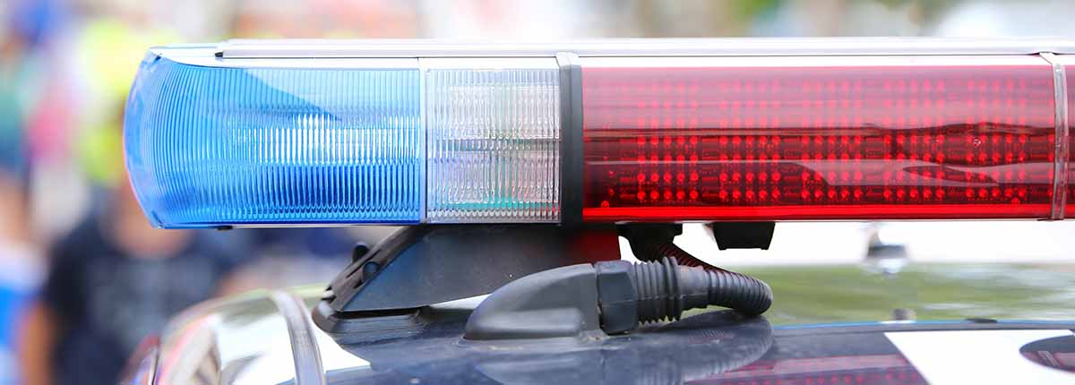 Red and blue lights on top of a police car