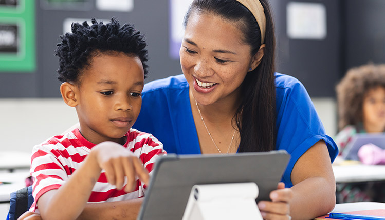 Elementary Education teacher with child