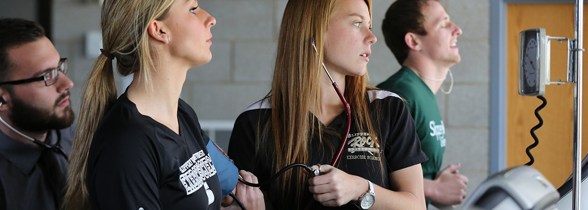 Exercise science professor speaking with colleague