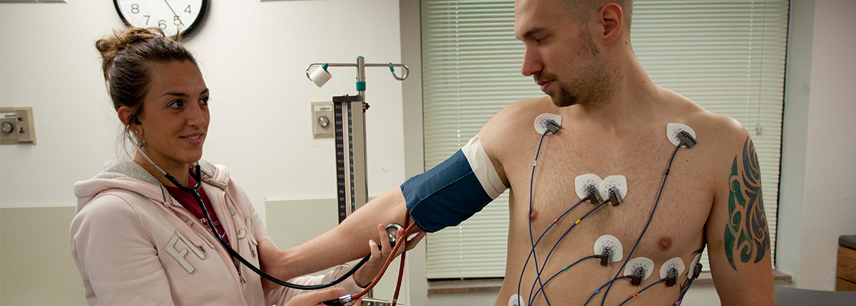 Physician assistant works on patient