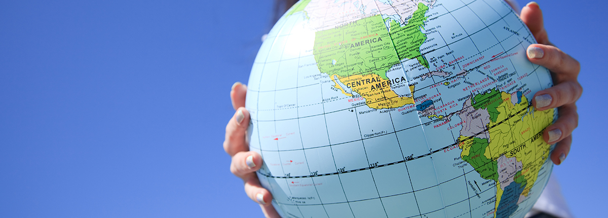 Student holds globe