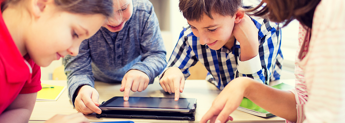 Children using tablet for education