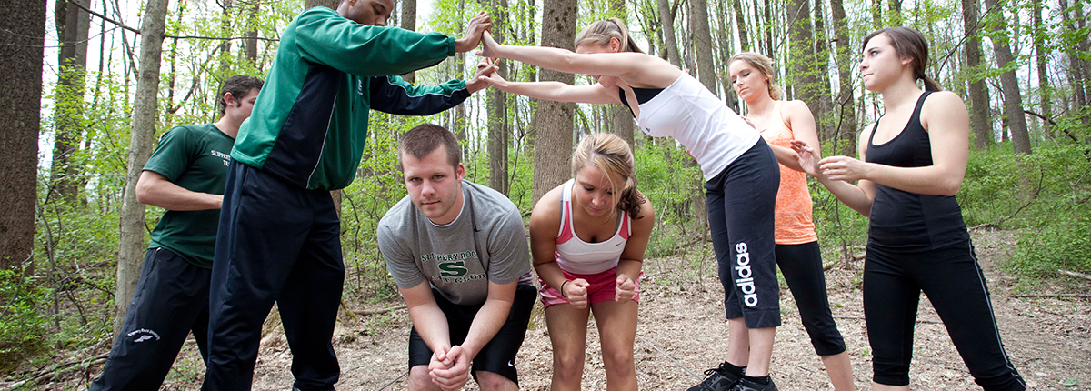 Students participating in teambuilding exercises