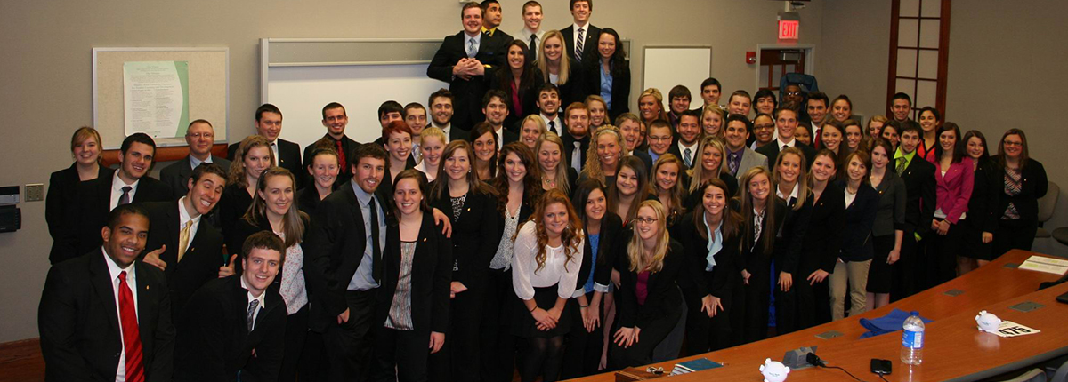 Students take group photo in classroom