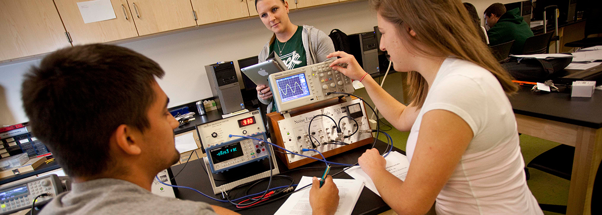 Physics students in a lab
