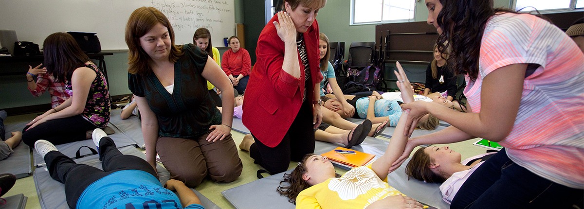 Students helping children