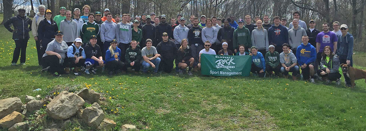 Sport Management students volunteering to clean up a park