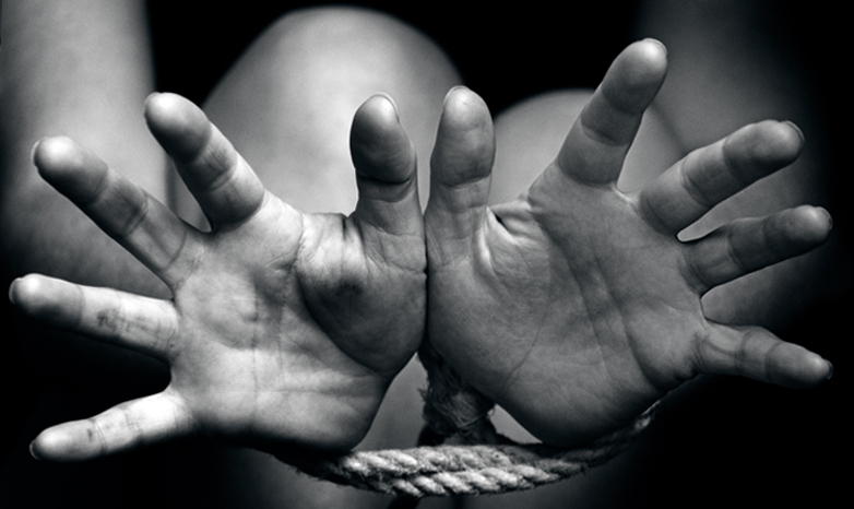hands bound with rope