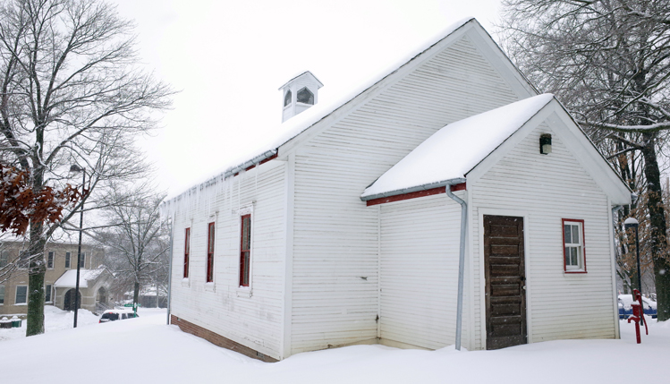 old school house in snow