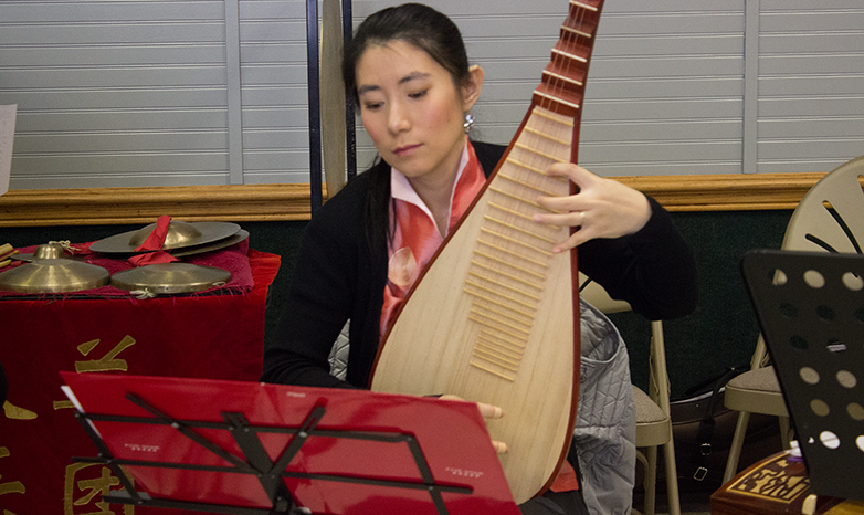 chinese new year musician playing stringed instrument