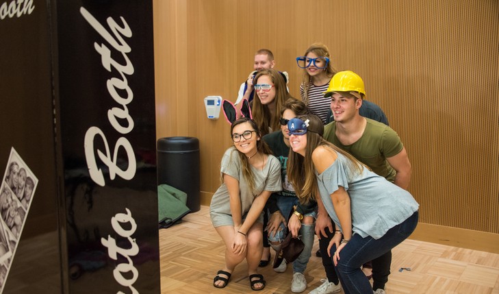 Students pose for photo booth