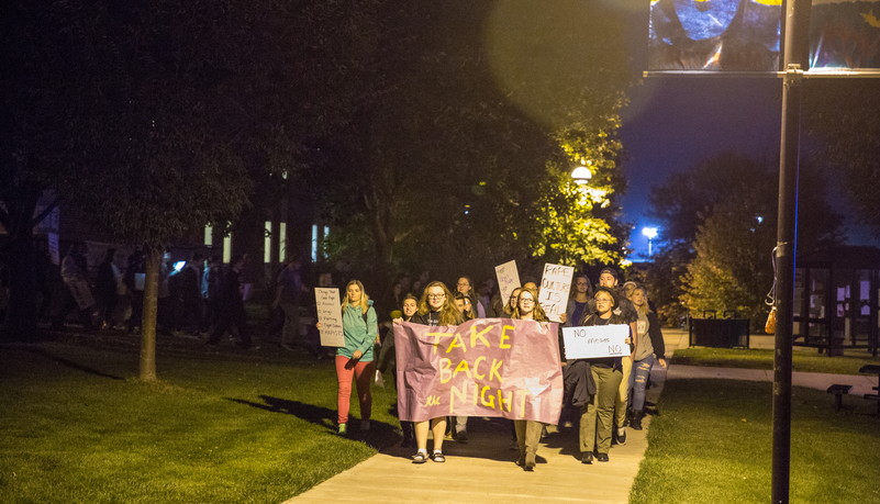 Group of students holding signs