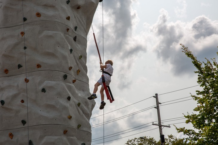 kid climbs rockwall