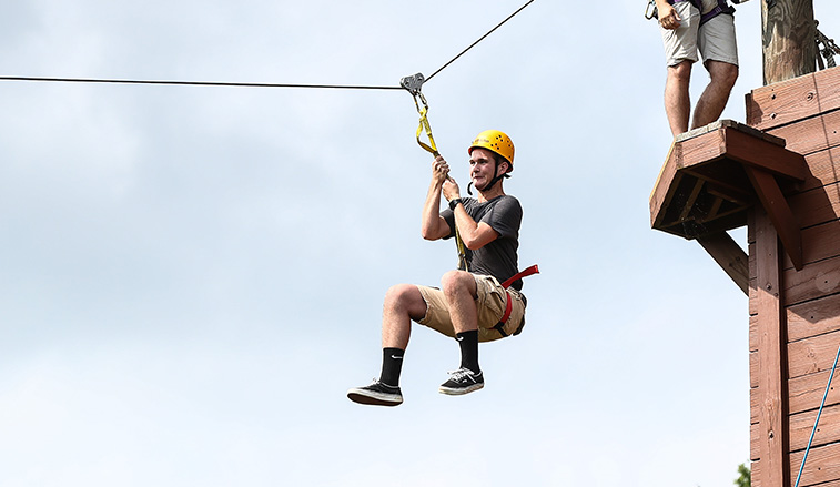 Student on a zip line