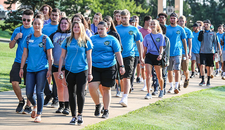 The class of 2022 make their way across campus to convocation