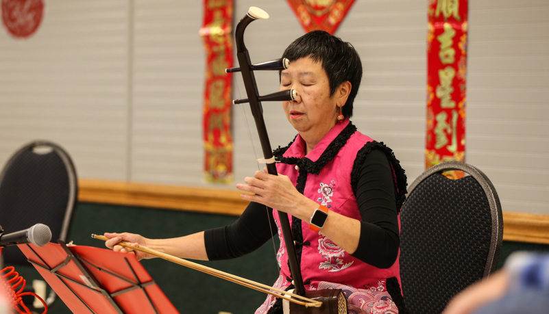 Woman playing traditional Chinese music