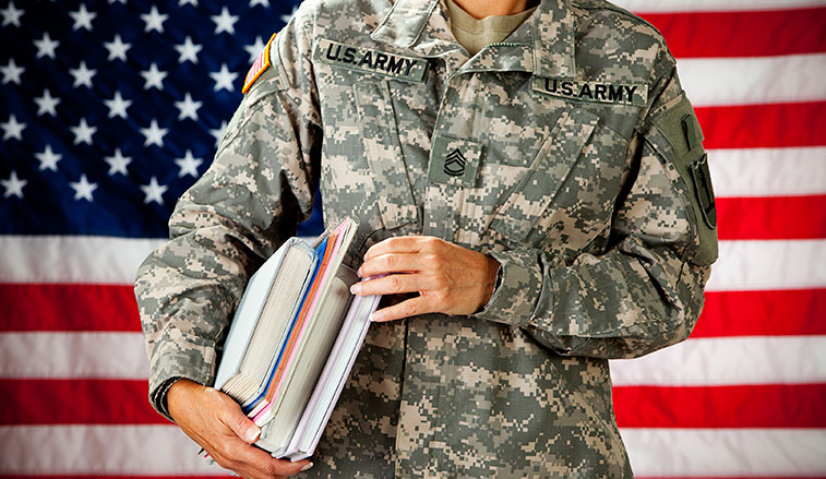 US Army soldier holding books