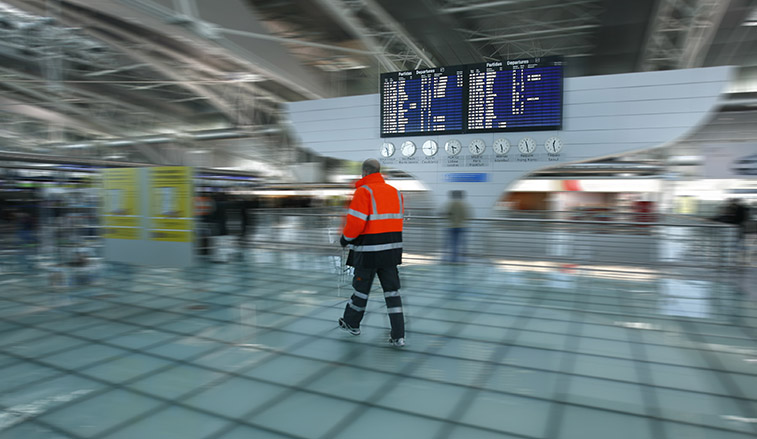 man walking through an airport