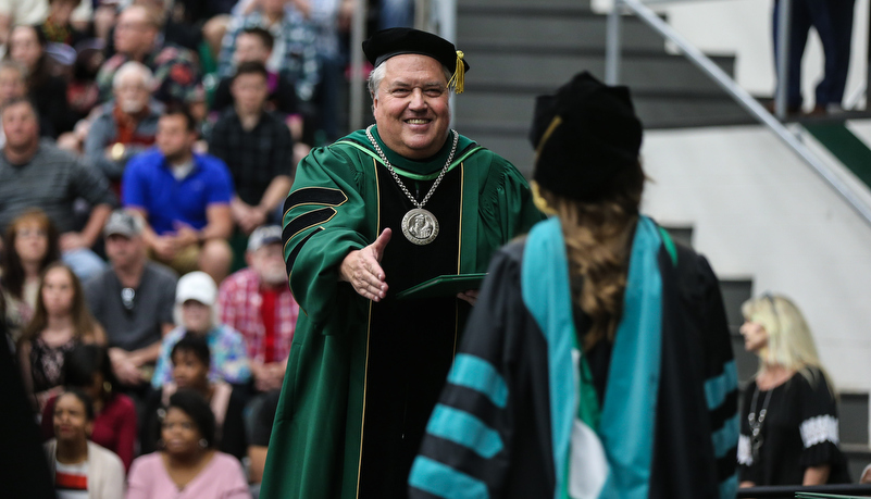 Dr Way greets a graduate