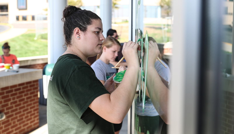 Students painting windows