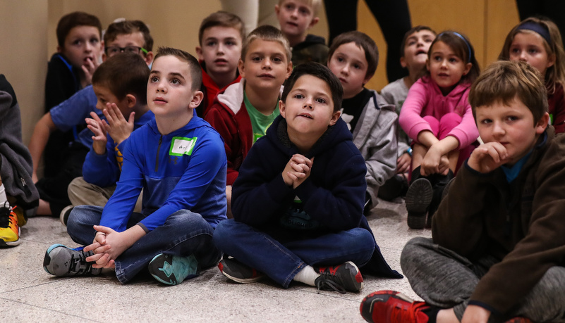 Second graders listen to a presentation